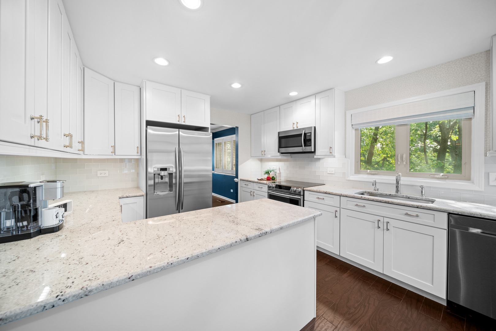 710 Ballantrae Drive, Unit B Northbrook, IL 60062 - Photo 10 of 28 a large kitchen with granite countertop a sink stainless steel appliances and cabinets