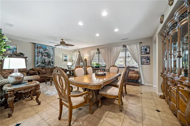a living room with furniture a rug and a chandelier