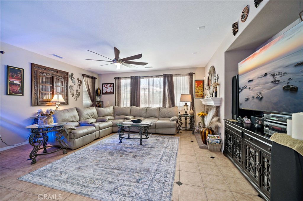 29009 Smooth Sailing Court Menifee, CA 92585 - Photo 22 of 62 a living room with furniture and a flat screen tv