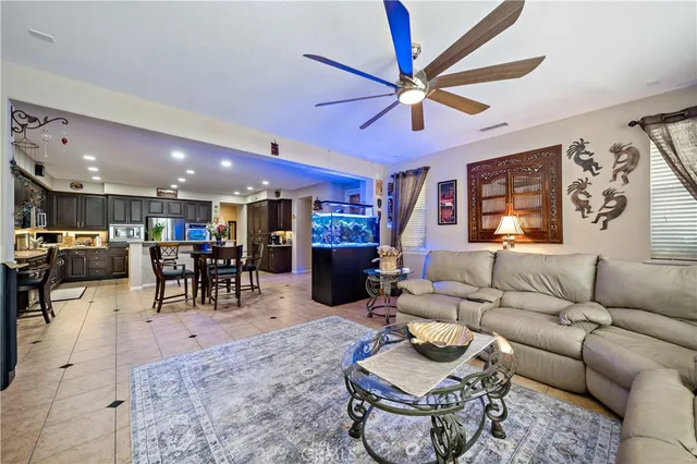 a large bathroom with a tub a sink and a large mirror