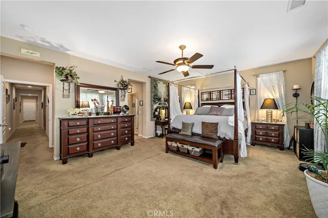 a bathroom with a granite countertop toilet a sink and a mirror