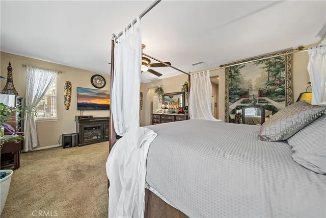 a bed room with a bed and a window