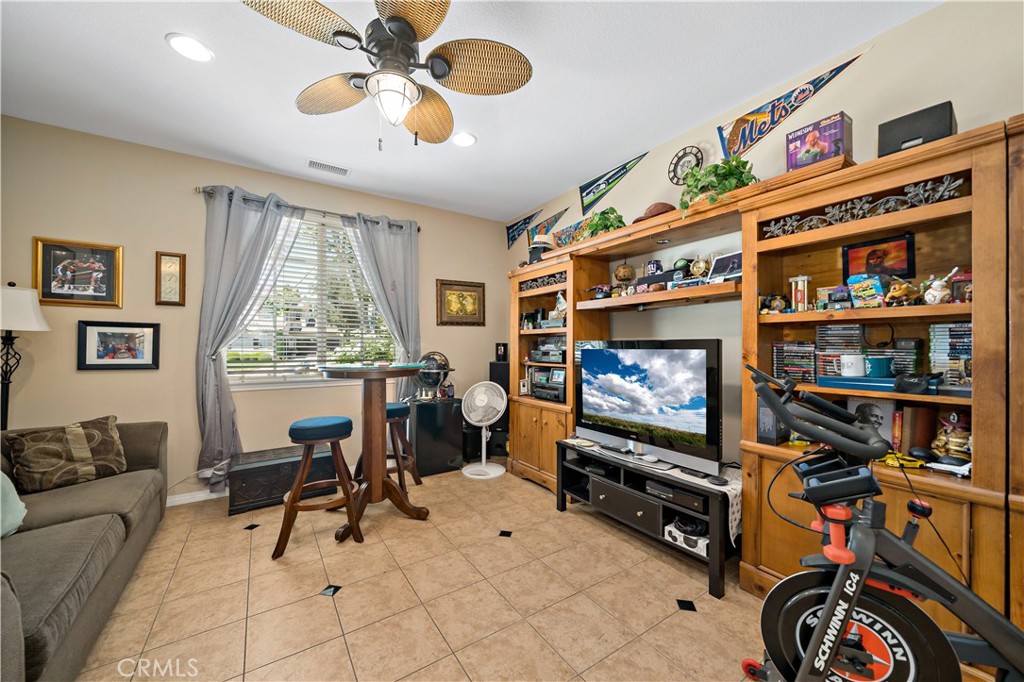 29009 Smooth Sailing Court Menifee, CA 92585 - Photo 30 of 62 a living room with furniture and a flat screen tv
