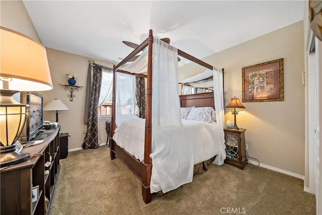 a view of a backyard with plants and chairs
