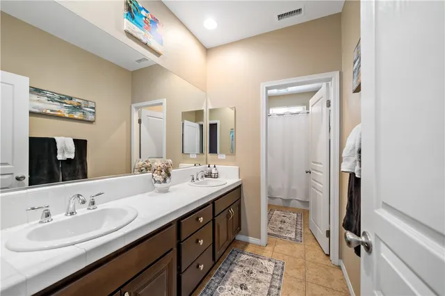 a view of a house with backyard porch and sitting area