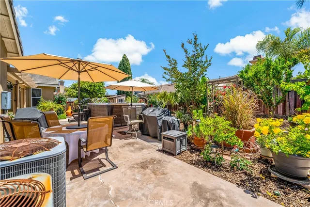 a view of yard with swimming pool and furniture