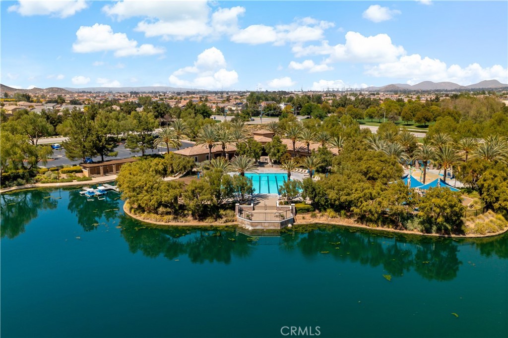 29009 Smooth Sailing Court Menifee, CA 92585 - Photo 57 of 62 a view of a lake with houses in back
