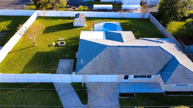 a view of swimming pool with outdoor seating