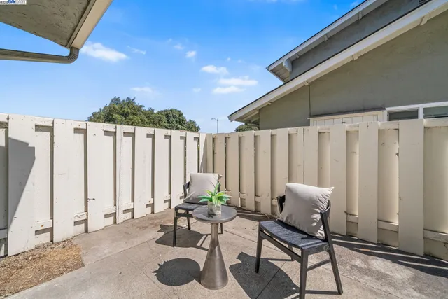 a view of a chairs and tables in the patio