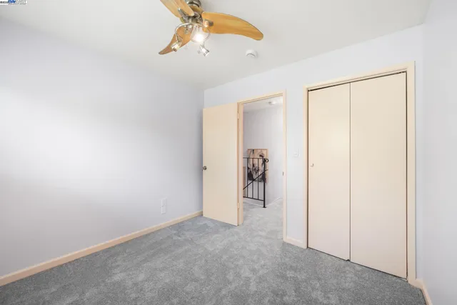 a bed room with a bed and a chandelier