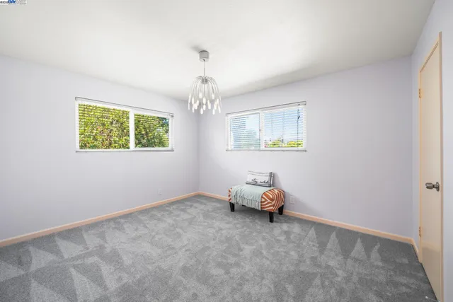 a bathroom with a sink mirror and toilet