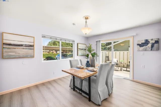 a view of a dining room with furniture window and outside view