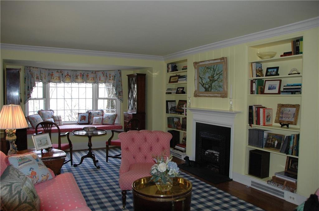 508 Beaver Road Edgeworth, PA 15143 - Photo 10 of 25 Living Room is large and has a bay window seat, decorative fireplace and bookcases.