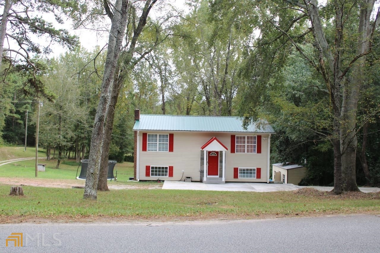 1174 Academy Church Road, Unit SOAPSTONE Jefferson, GA 30549 - Photo 1 of 1 a front view of house with yard and trees