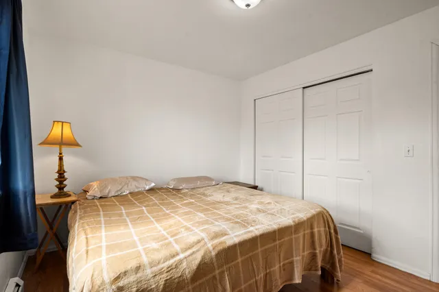 a bedroom with a bed and walk in closet