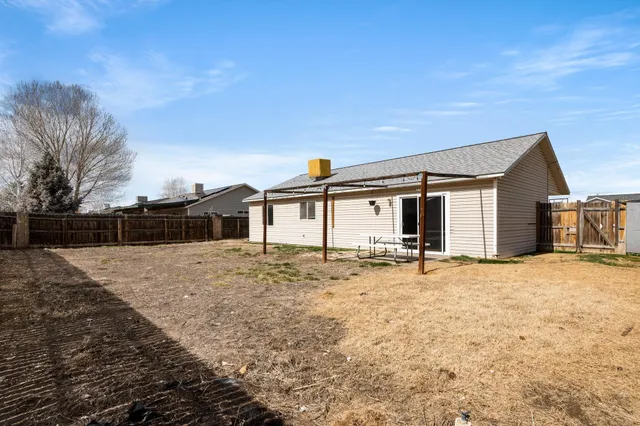 a view of a house with snow on the road