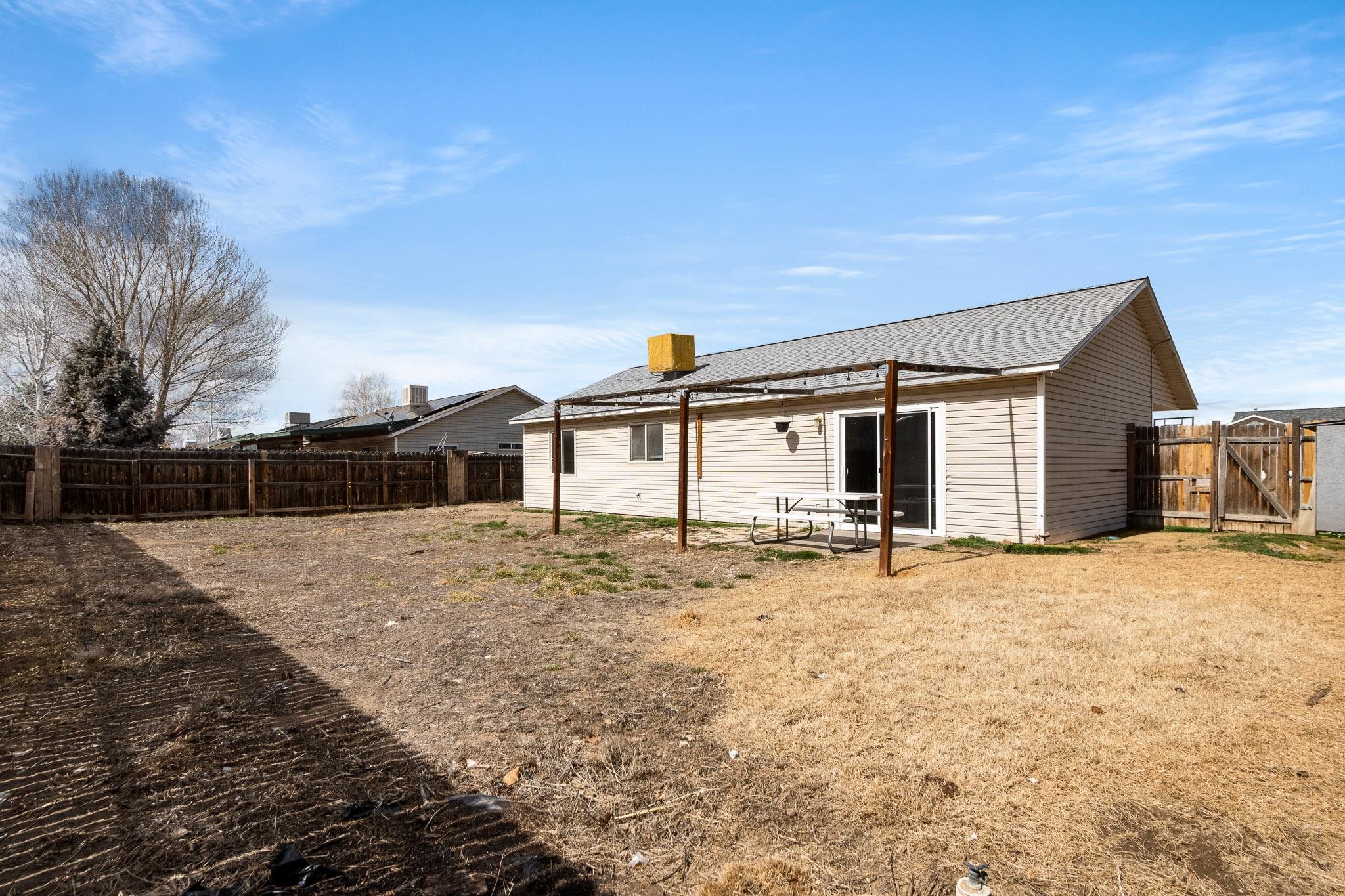 1456 Sagittarius Street Fruita, CO 81521 - Photo 16 of 19 a view of a house with snow on the road