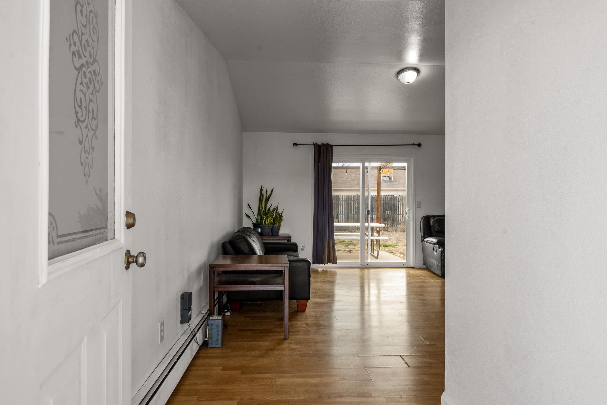 1456 Sagittarius Street Fruita, CO 81521 - Photo 2 of 19 a view of dining room with wooden floor and windows