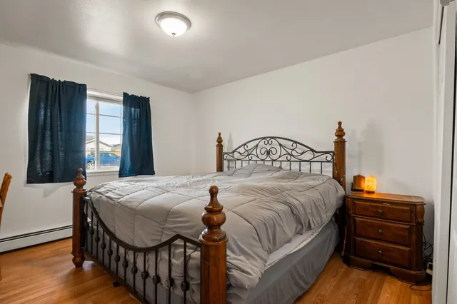 a bedroom with a bed and a dresser