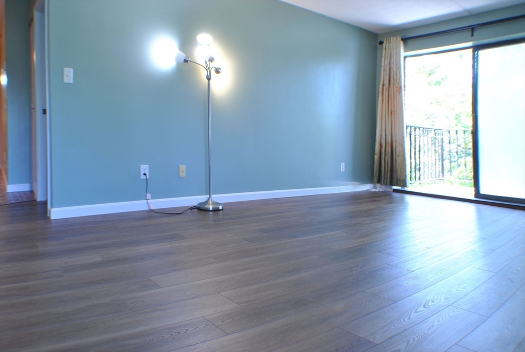 a view of a livingroom with wooden floor
