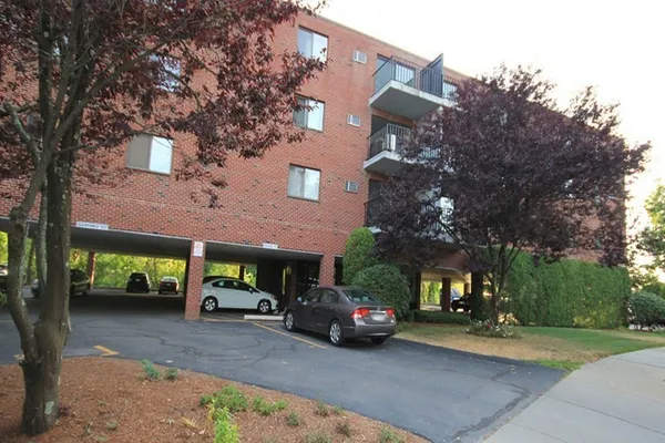 a view of a car parked in front of a building