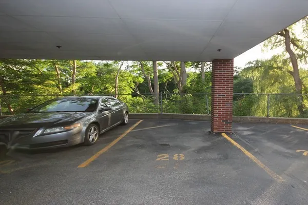 a view of a car parked in back yard