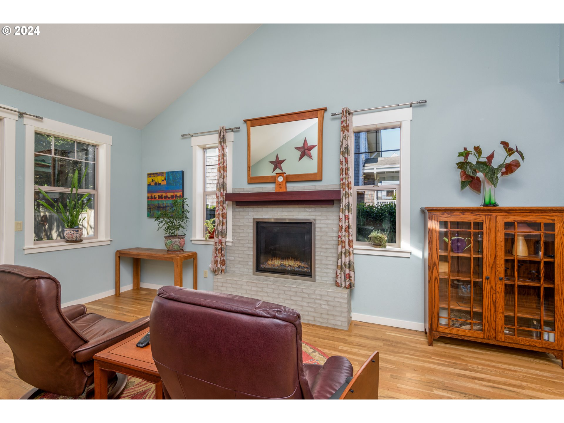 490 Lemwick Lane Yachats, OR 97498 - Photo 14 of 42 a living room with furniture a fireplace and a window