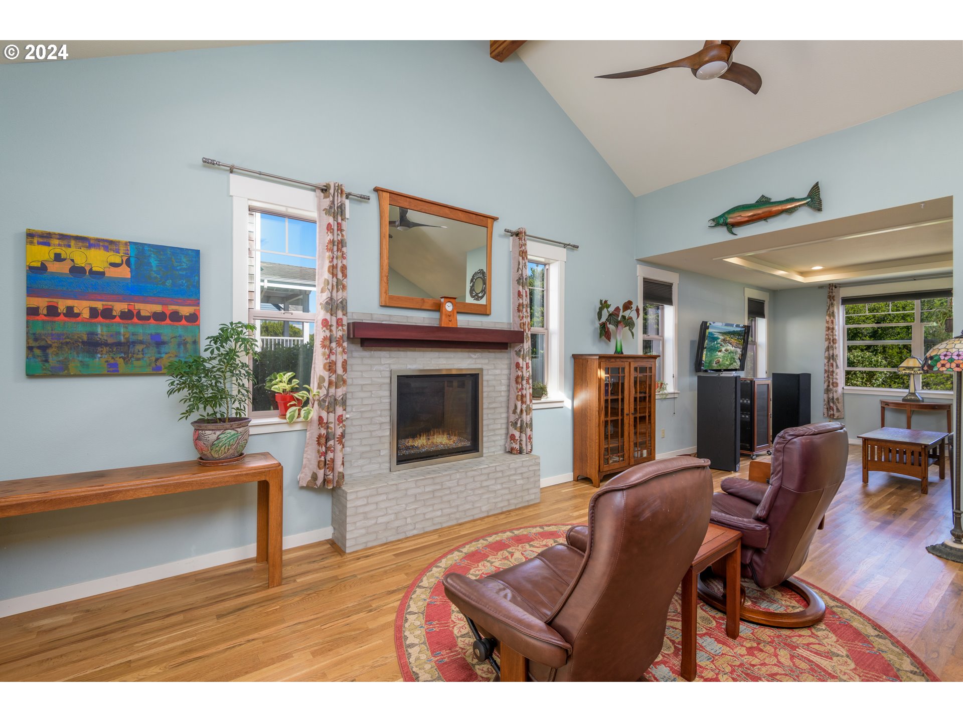 490 Lemwick Lane Yachats, OR 97498 - Photo 15 of 42 a living room with furniture and a fireplace