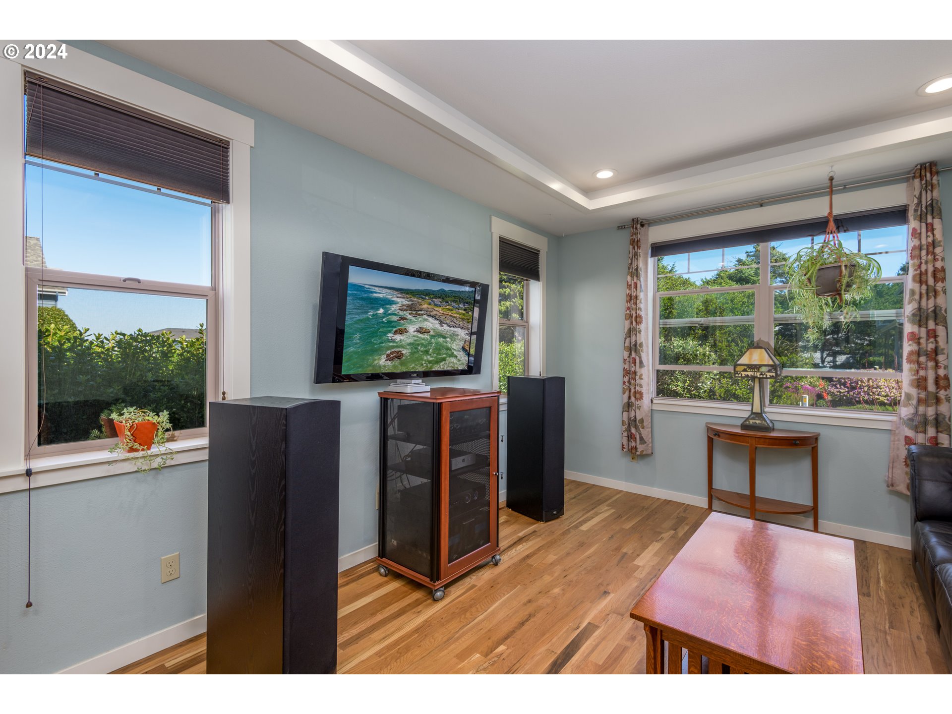490 Lemwick Lane Yachats, OR 97498 - Photo 17 of 42 a living room with furniture and a flat screen tv