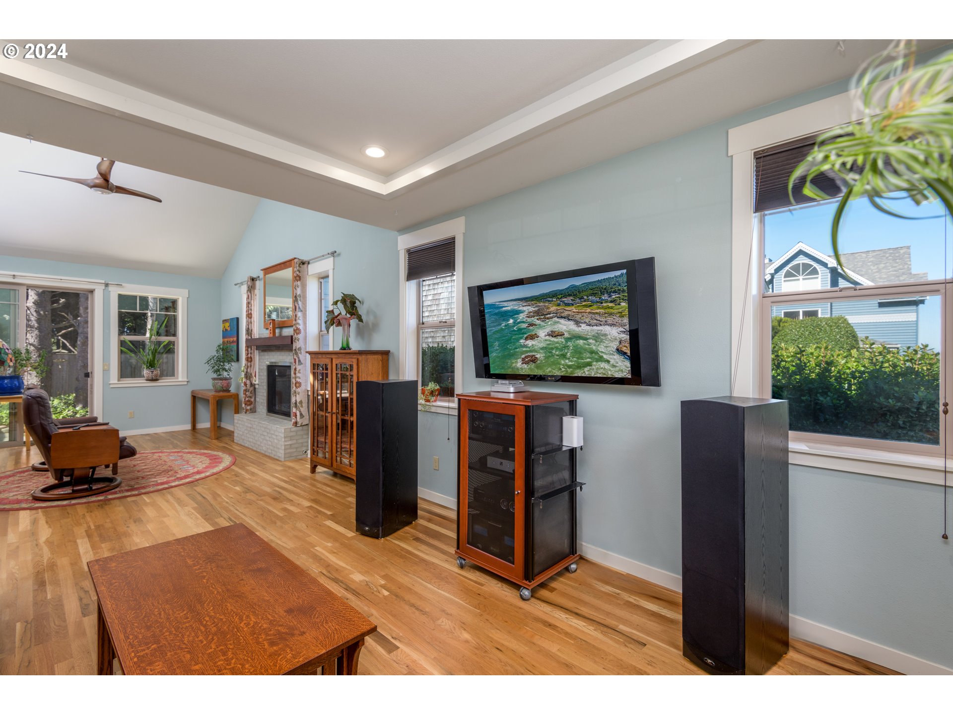 490 Lemwick Lane Yachats, OR 97498 - Photo 19 of 42 a living room with furniture and a flat screen tv