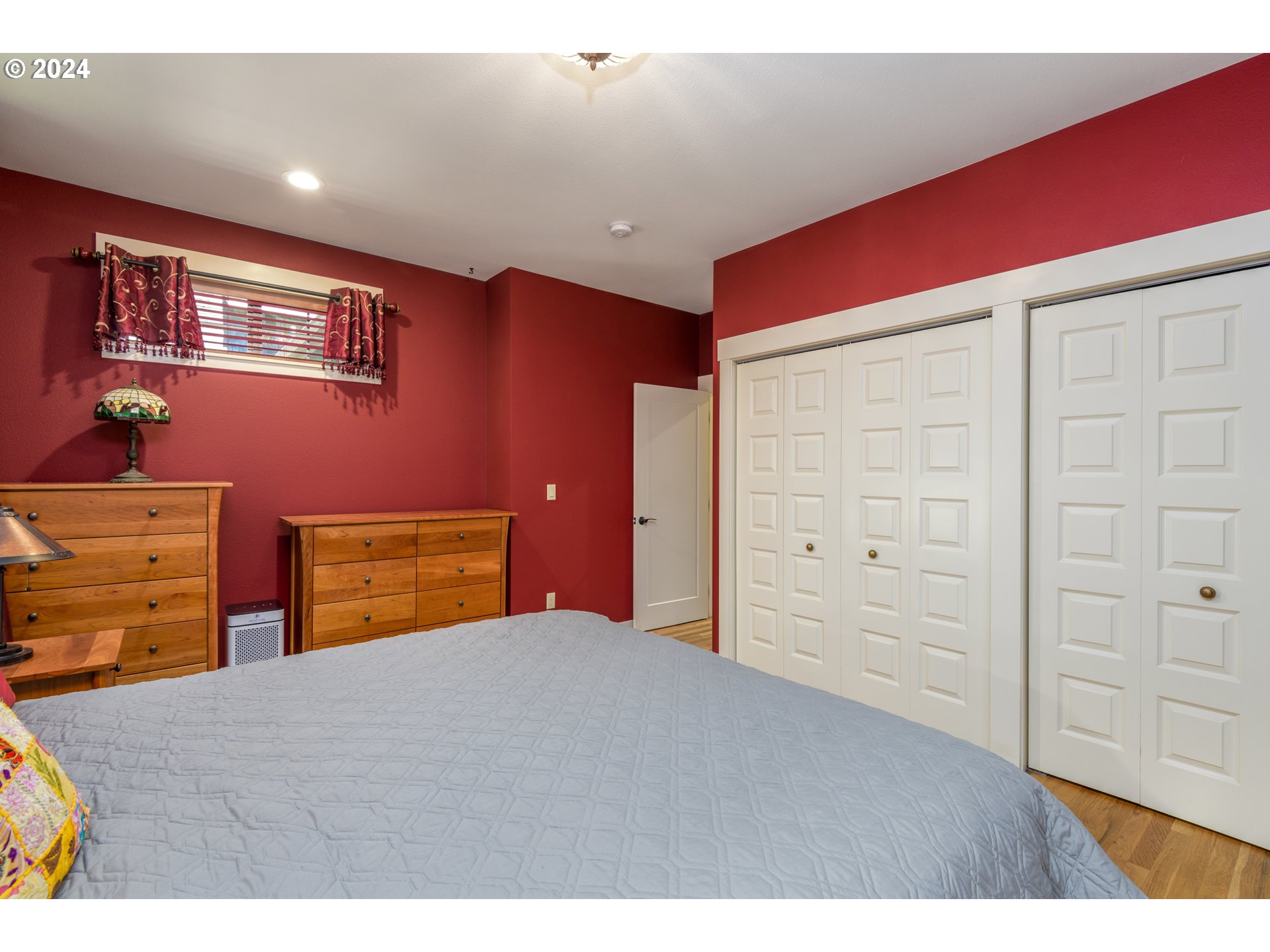 490 Lemwick Lane Yachats, OR 97498 - Photo 24 of 42 a bedroom with a bed and a dresser