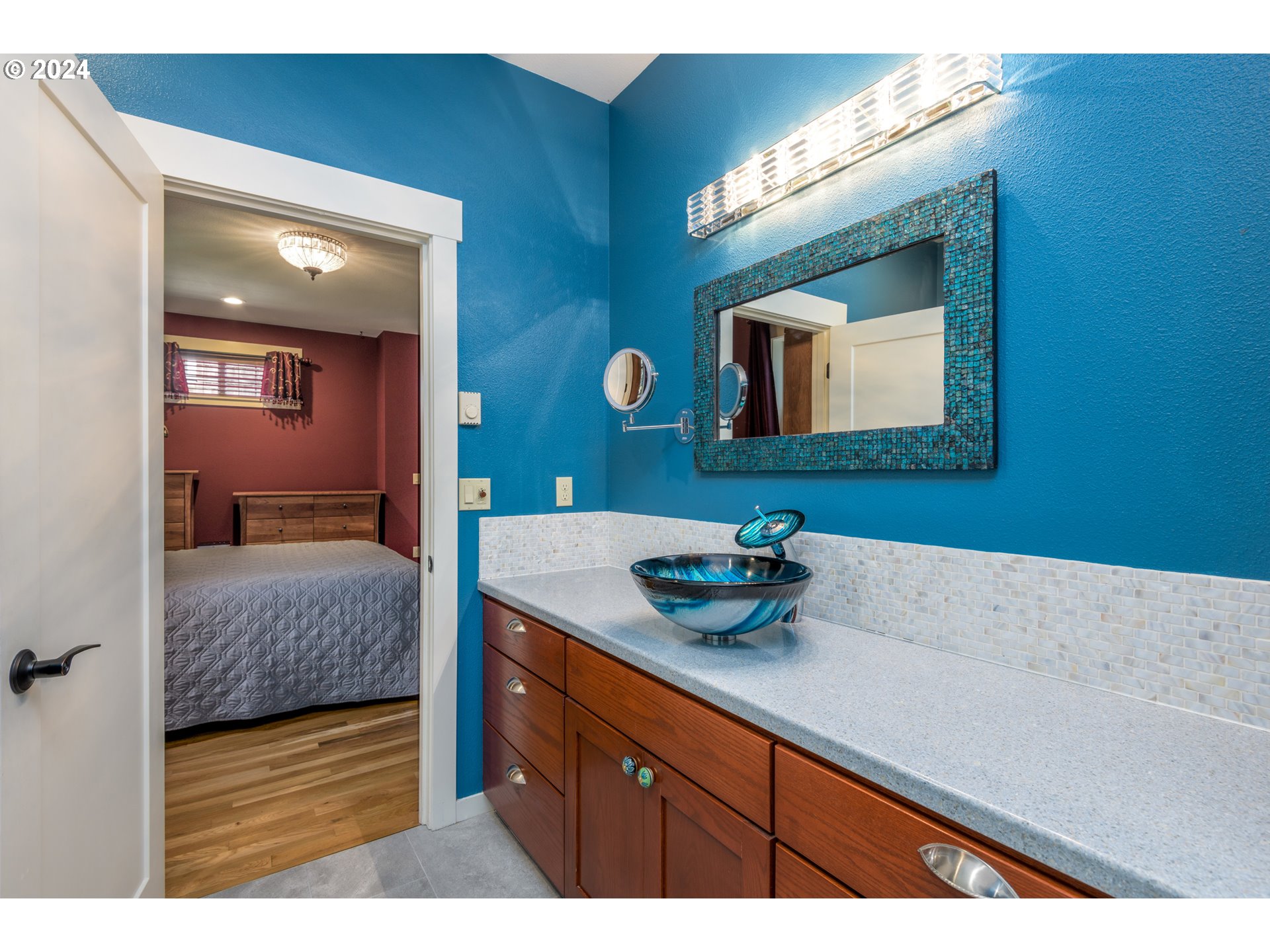 490 Lemwick Lane Yachats, OR 97498 - Photo 25 of 42 a en suite bathroom with a sink and a mirror