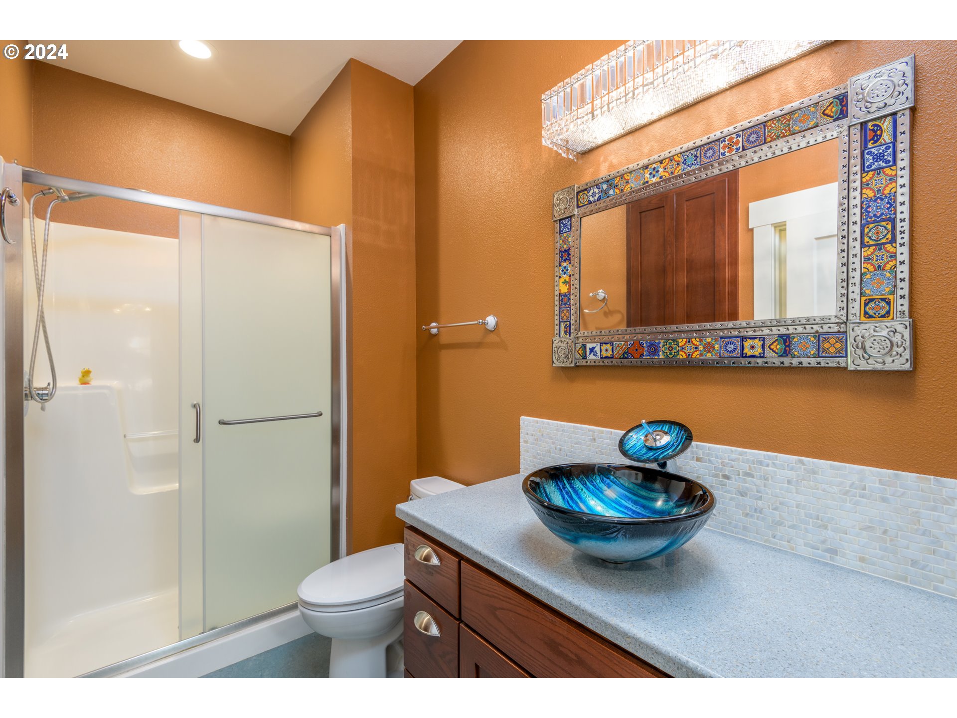 490 Lemwick Lane Yachats, OR 97498 - Photo 30 of 42 a bathroom with a sink a toilet and shower curtain