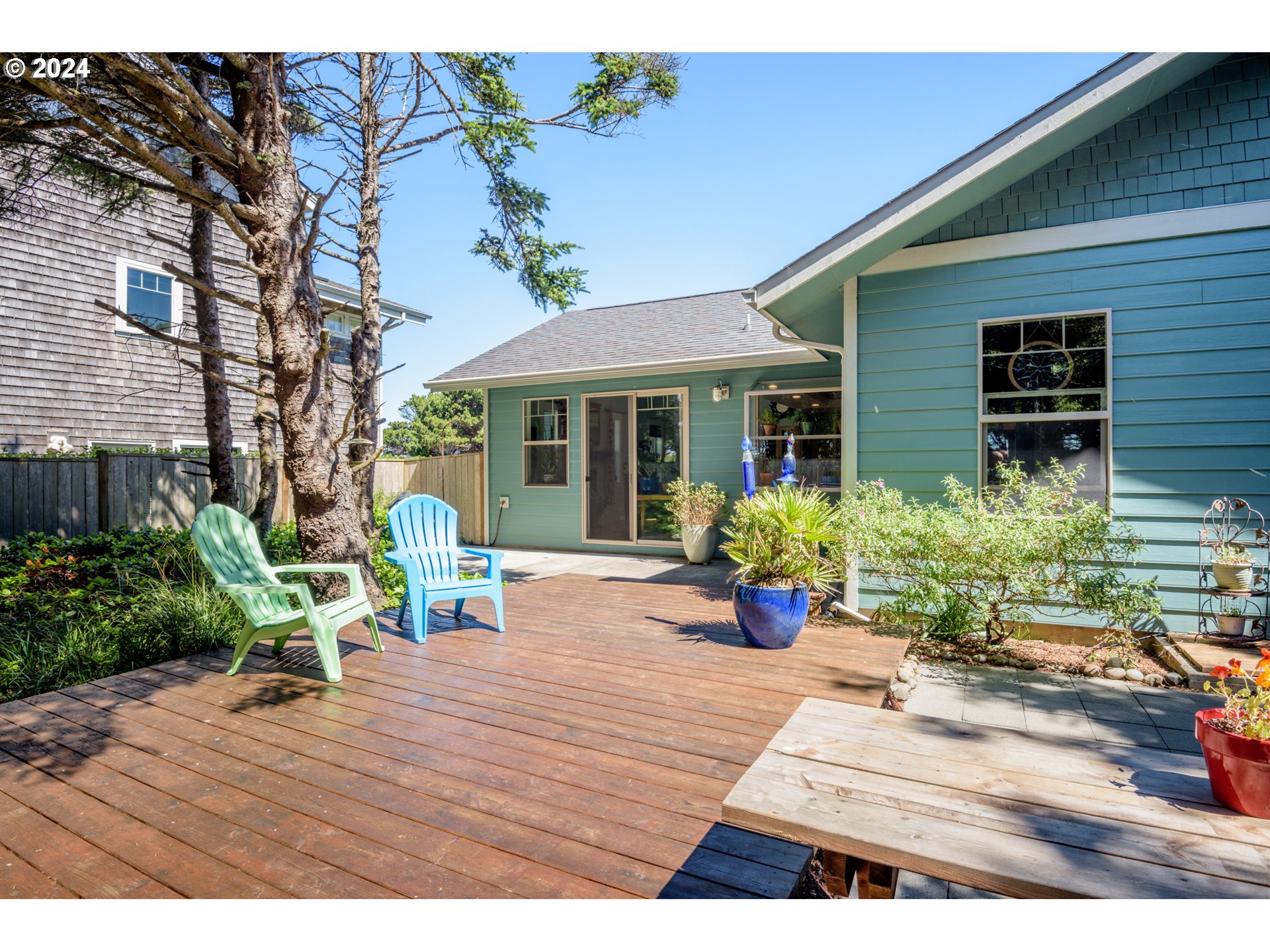 490 Lemwick Lane Yachats, OR 97498 - Photo 32 of 42 a view of a house with sitting area and garden