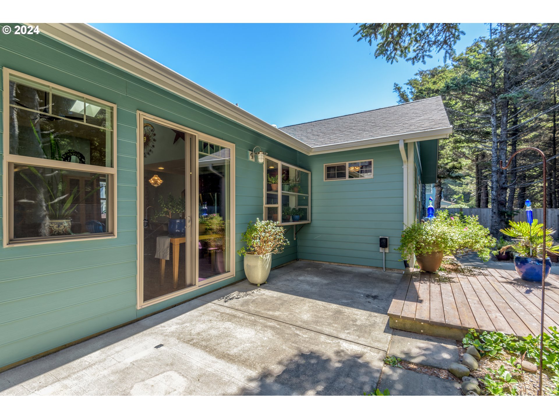 490 Lemwick Lane Yachats, OR 97498 - Photo 33 of 42 a front view of a house with a yard
