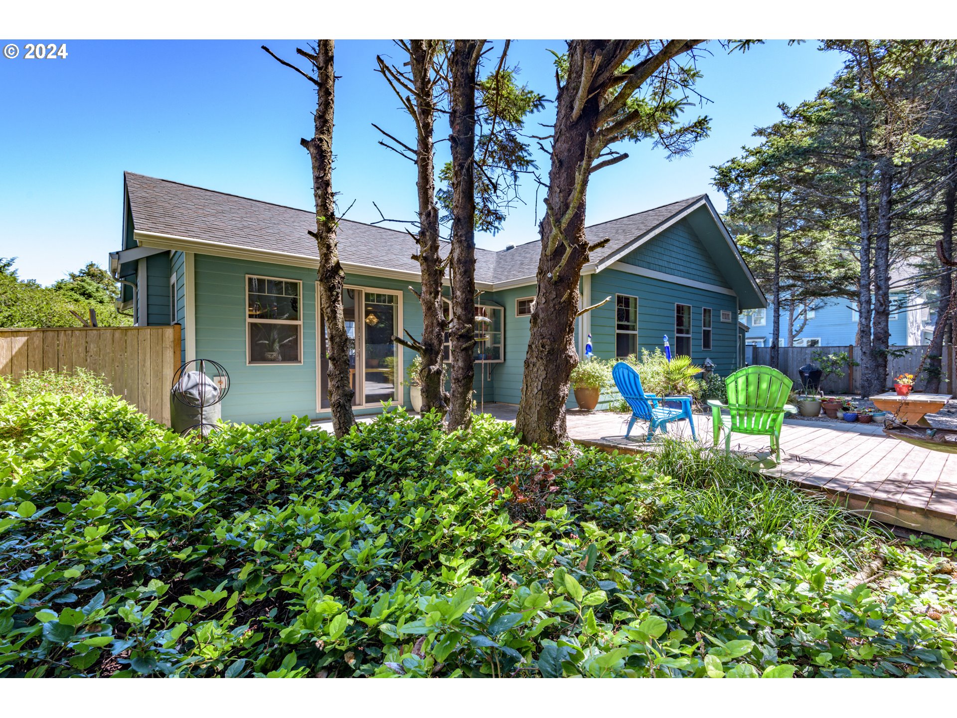 490 Lemwick Lane Yachats, OR 97498 - Photo 35 of 42 a view of a house with backyard sitting area and garden