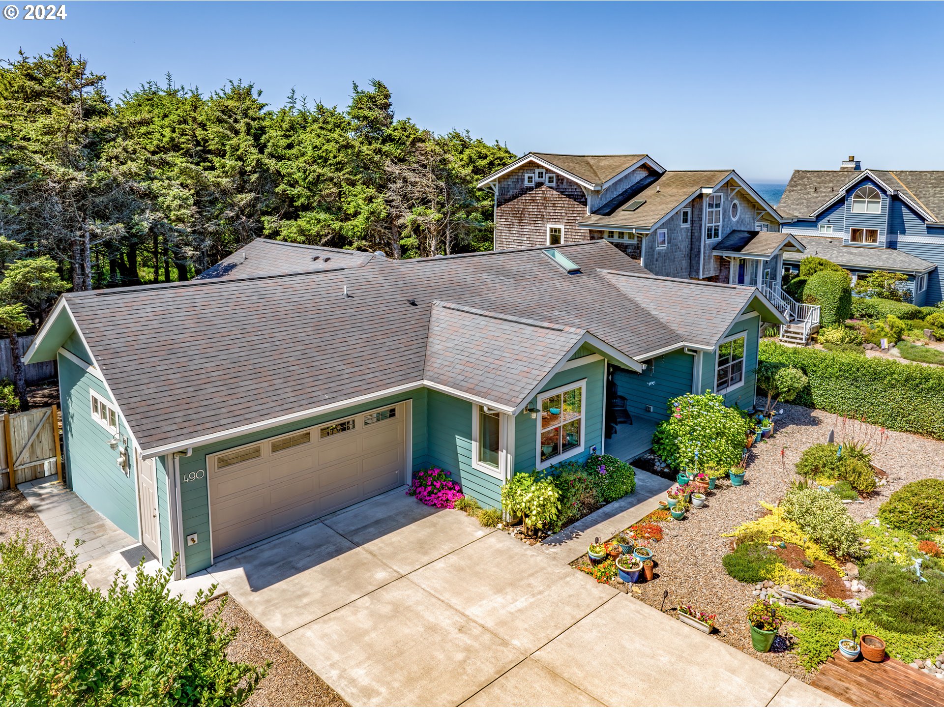 490 Lemwick Lane Yachats, OR 97498 - Photo 5 of 42 aerial view of a house with a yard and potted plants
