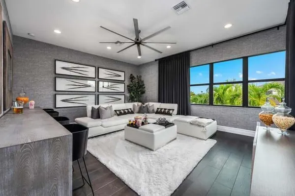 a living room with furniture and a large window