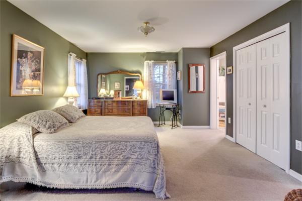 12 Sargent Road Winchester, MA 01890 - Photo 18 of 30 a bedroom with a large bed couch and a window