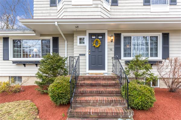 12 Sargent Road Winchester, MA 01890 - Photo 4 of 30 a front view of a house with potted plants