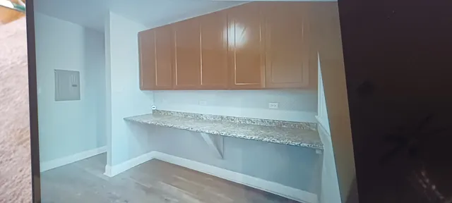 a room with a sink and cabinets