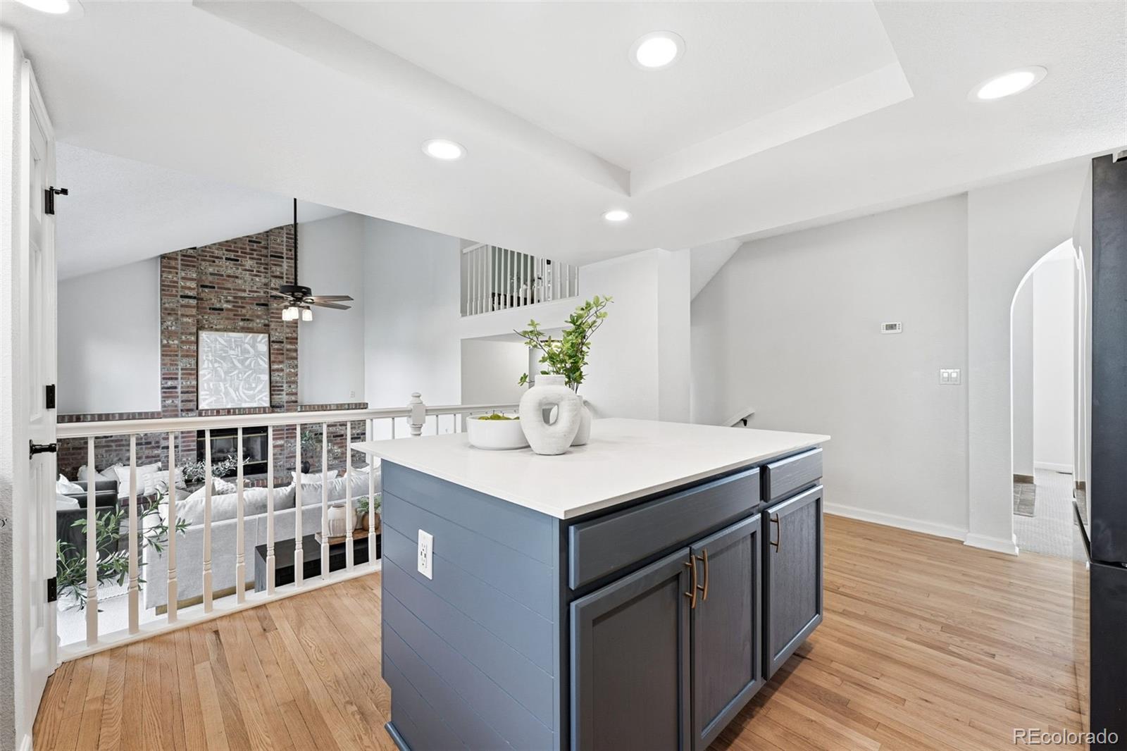 9426 Princeton Circle Highlands Ranch, CO 80130 - Photo 14 of 50 a kitchen with counter top space and wooden floor