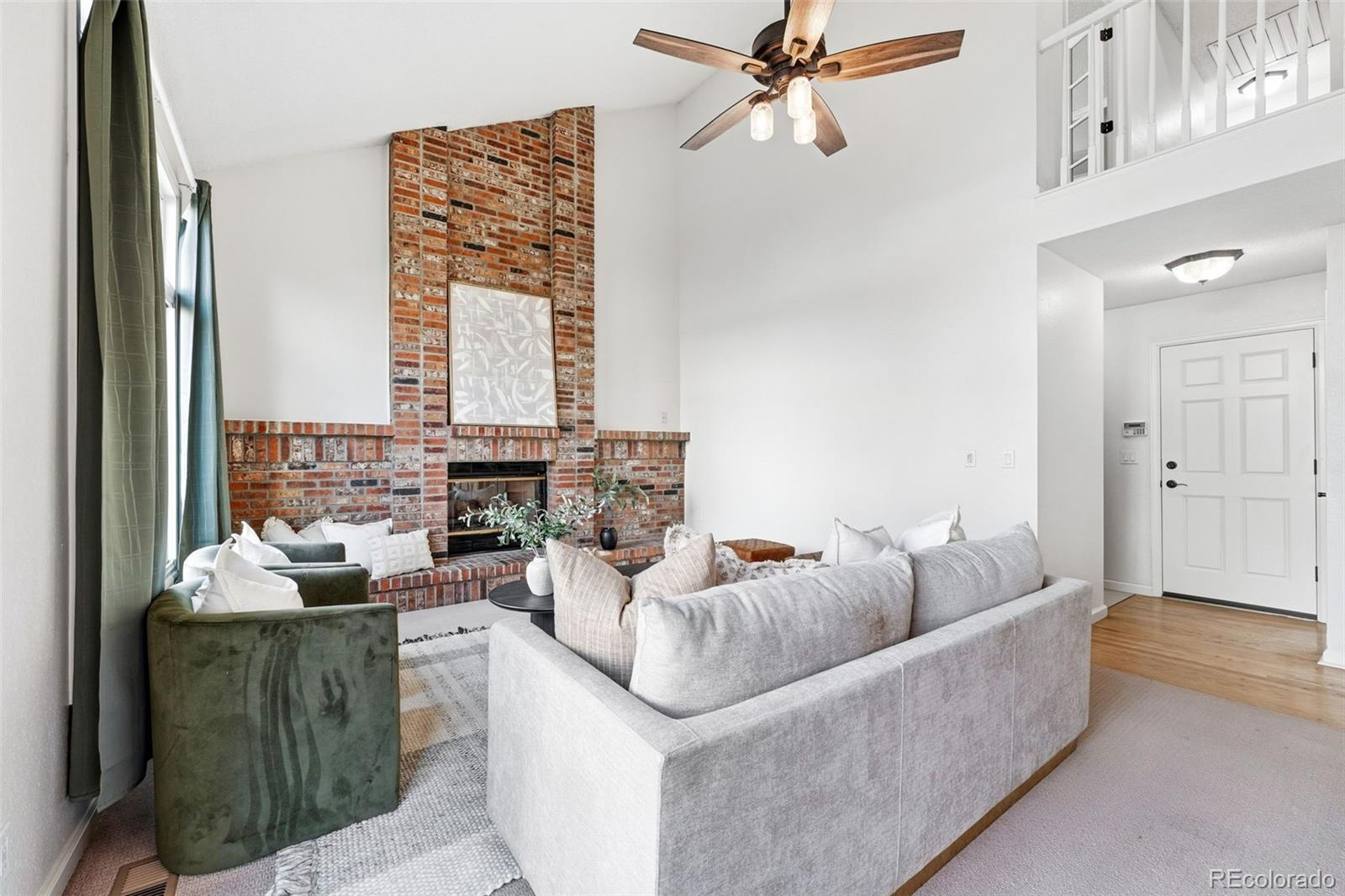 9426 Princeton Circle Highlands Ranch, CO 80130 - Photo 17 of 50 a living room with furniture and a window