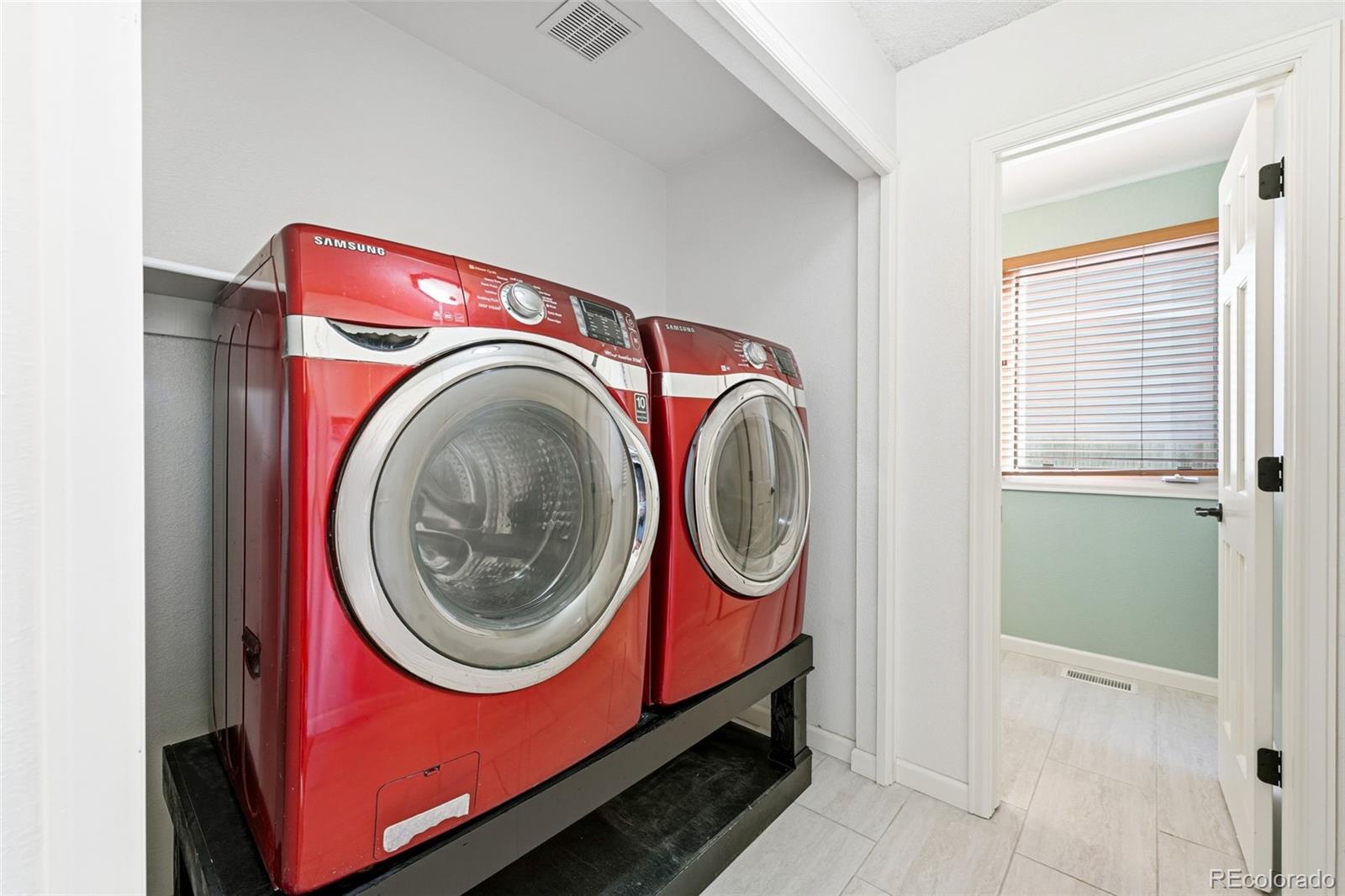 9426 Princeton Circle Highlands Ranch, CO 80130 - Photo 24 of 50 a utility room with dryer and washer