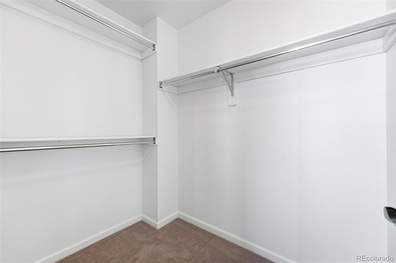 9426 Princeton Circle Highlands Ranch, CO 80130 - Photo 31 of 50 a view of an empty walk in closet