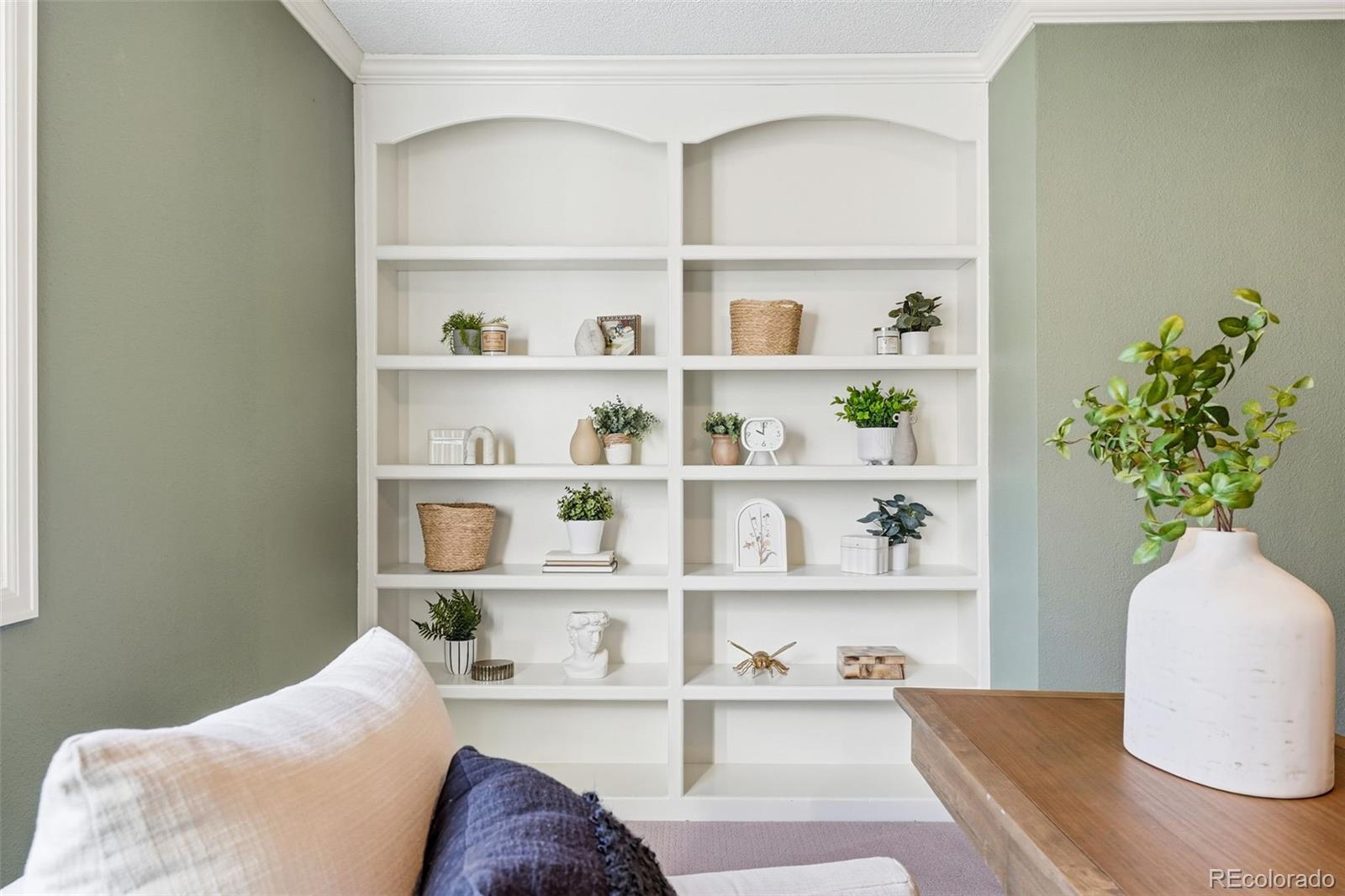 9426 Princeton Circle Highlands Ranch, CO 80130 - Photo 34 of 50 a bedroom with a bed and a book shelf