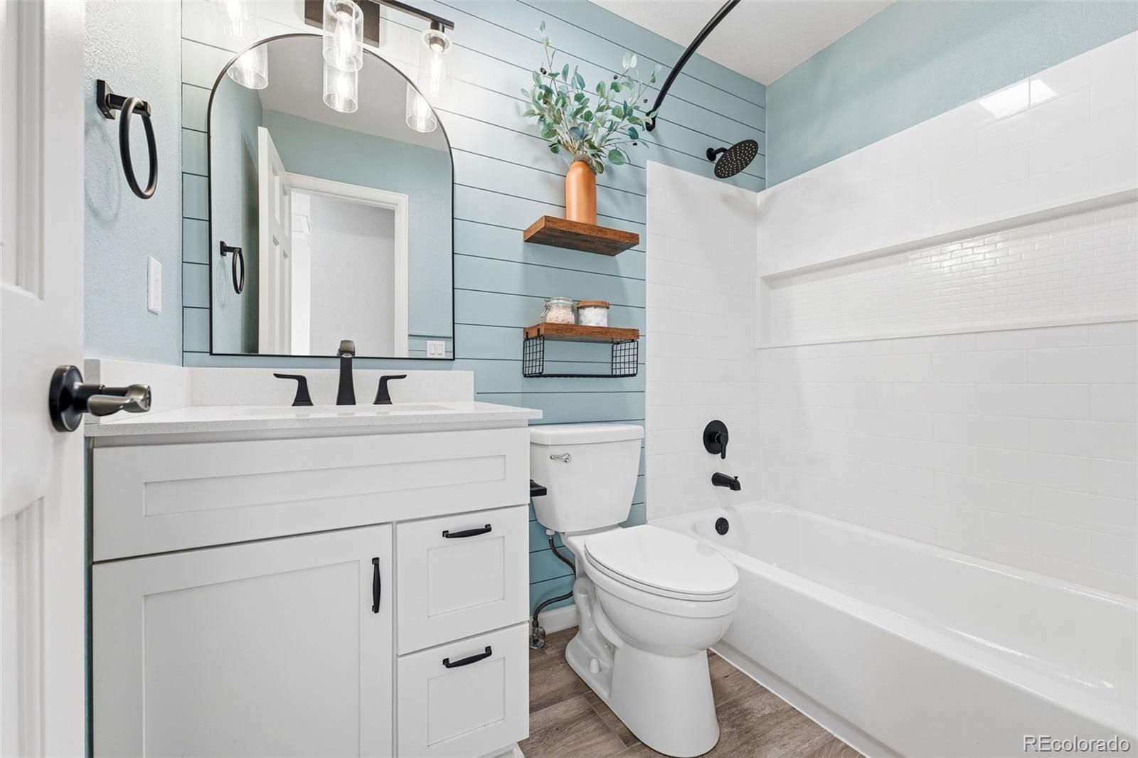 9426 Princeton Circle Highlands Ranch, CO 80130 - Photo 36 of 50 a bathroom with a sink a toilet and shower