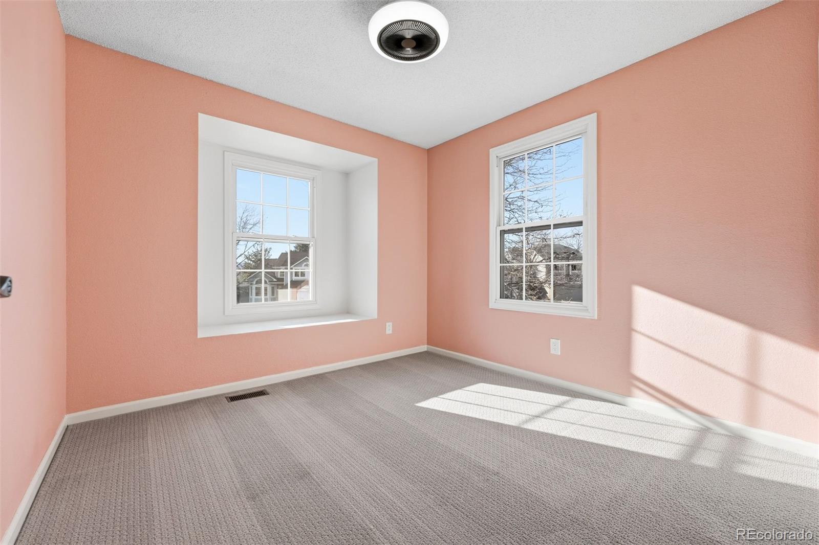 9426 Princeton Circle Highlands Ranch, CO 80130 - Photo 38 of 50 an empty room with windows