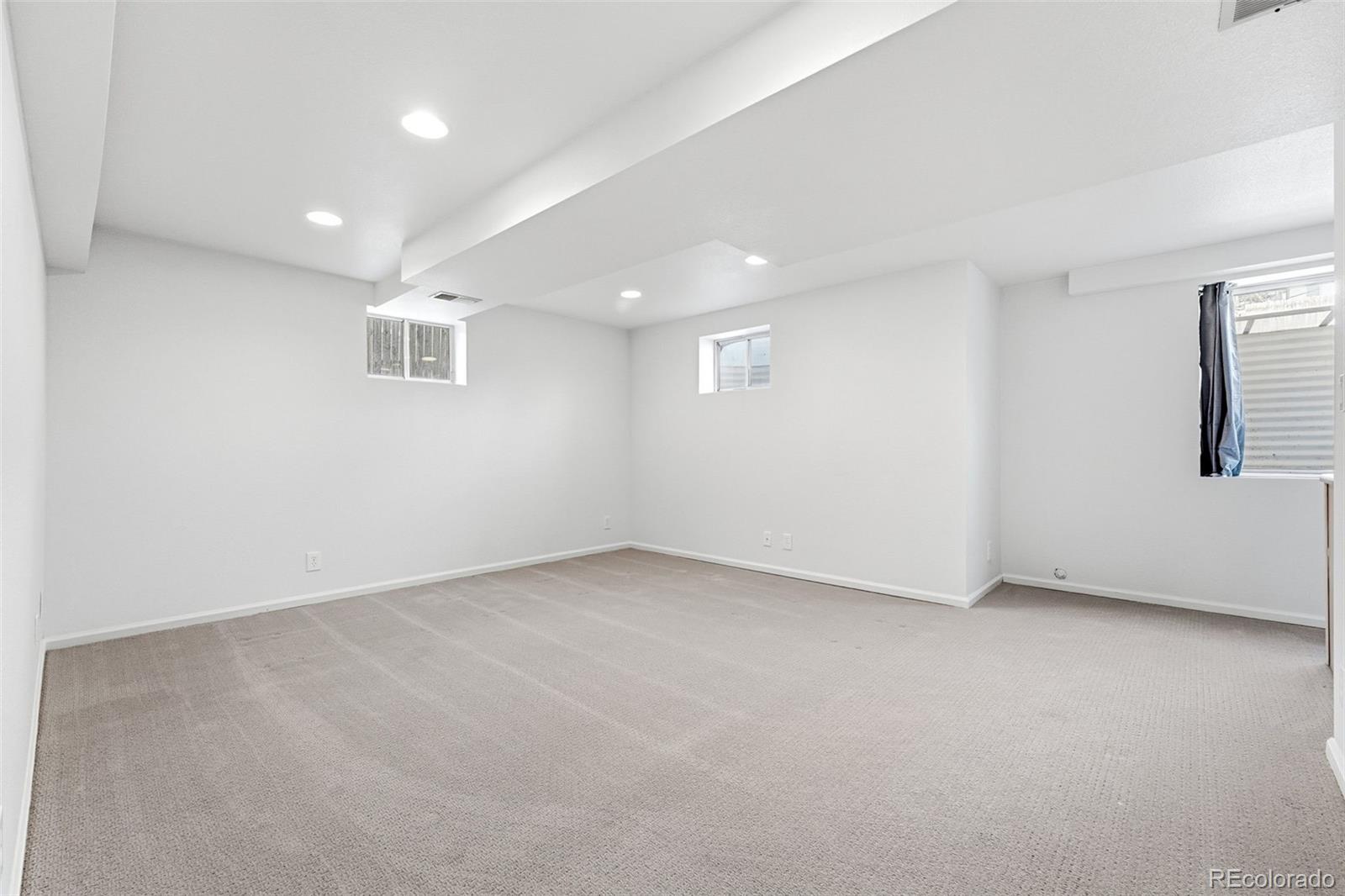 9426 Princeton Circle Highlands Ranch, CO 80130 - Photo 40 of 50 an empty room with windows