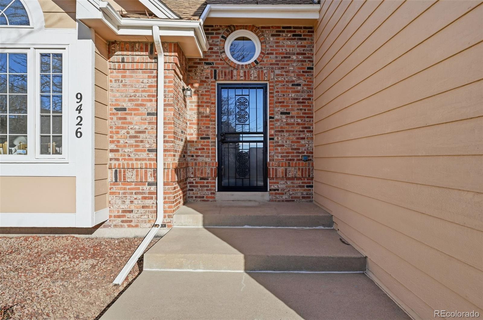 9426 Princeton Circle Highlands Ranch, CO 80130 - Photo 4 of 50 a sign board with a small yard